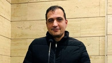 a man in a black jacket