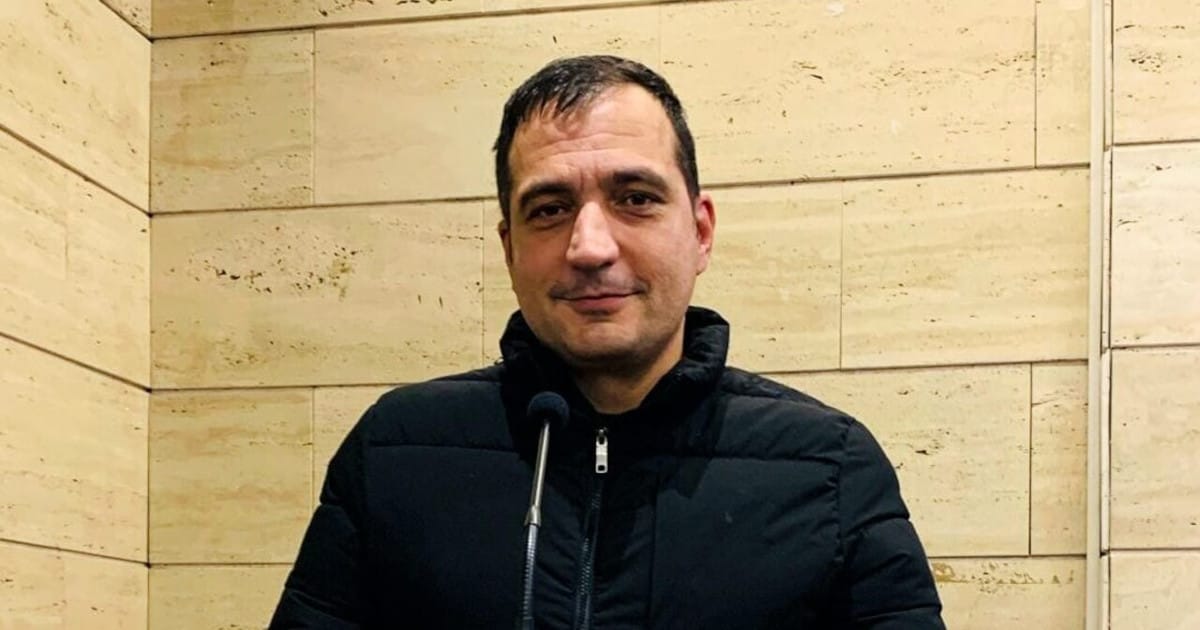 a man in a black jacket